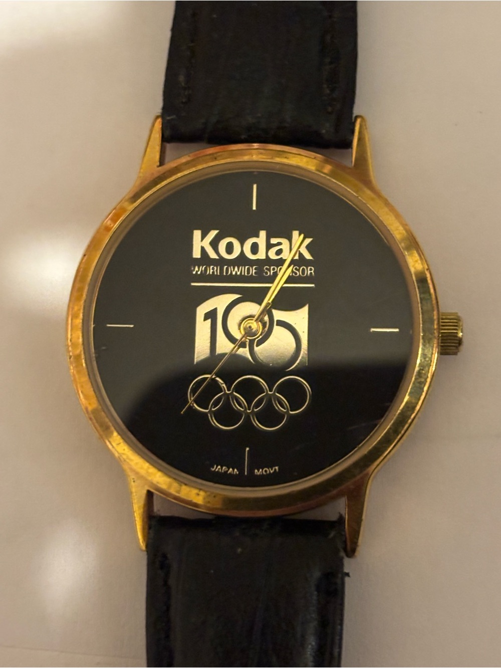 Kodak Gold and Black Kodak Logo Dress Watch
